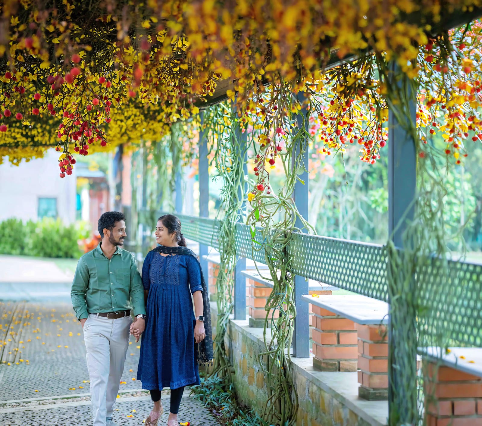 A Film Wedding Days couple beneath a canopy of golden blossoms